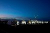 Several tents are set up so people who have registered can get their COVID-19 vaccinations as they drive-thru the parking lot of the State Farm Stadium, Tuesday, Jan. 12, 2021, in Glendale, Ariz. The Arizona Cardinals' stadium opened as a vaccination site Monday that will be a 24-7 operation. (AP Photo/Ross D. Franklin)