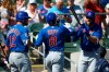 Chicago Cubs' Ian Happ (8) celebrates his home run against the Colorado Rockies with Kyle Schwarber (12) and Steven Souza Jr., right, during the first inning of a spring training baseball game Tuesday, March 3, 2020, in Scottsdale, Ariz. (AP Photo/Ross D. Franklin)