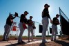 From left to right, Cleveland Indians pitchers Dominic Leone, Logan Allen, Kyle Dowdy, Shane Bieber, and Carlos Carrasco wait their turn for their pitching session during spring training baseball workouts for pitchers and catchers Thursday, Feb. 13, 2020, in Avondale, Ariz. (AP Photo/Ross D. Franklin)