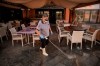 A staffer wearing a mask cleans the terrace of a shopping mall in La Caleta, in the Canary Island of Tenerife, Spain, Wednesday, Feb. 26, 2020. Worries over the ever-expanding economic fallout of the COVID-19 crisis multiplied, with factories idled, trade routes frozen and tourism crippled, while a growing list of countries braced for the illness to claim new territory. Even the Olympics, five months away, wasn't far enough off to keep people from wondering if it would go on as planned. (AP Photo)