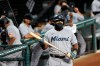 Miami Marlins' Jesus Aguilar wears a face mask to protect against COVID-19 as he stands at the on deck circle during the first inning of a baseball game against the Baltimore Orioles, Tuesday, Aug. 4, 2020, in Baltimore, Md. (AP Photo/Julio Cortez)