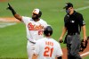 Baltimore Orioles' Hanser Alberto (57) gestures after hitting a two-run home run off New York Yankees starting pitcher J.A. Happ during the first inning of a baseball game, Thursday, July 30, 2020, in Baltimore. Orioles' Austin Hays (21), who scored on the play, looks on. (AP Photo/Julio Cortez)