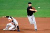 Baltimore Orioles' Andrew Velazquez, left, is out at second as Miami Marlins second baseman Logan Forsythe, right, throws to first to get out Orioles' Hanser Alberto to complete a double play during the ninth inning of a baseball game, Thursday, Aug. 6, 2020, in Baltimore. (AP Photo/Nick Wass)