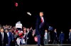 U.S. President Donald Trump throws hats to supporters after speaking at a campaign rally at Duluth International Airport in Duluth, Minn., on Wednesday.  (AP Photo/Alex Brandon, File)