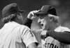 FILE - In this April 19, 1985, file photo, Boston Red Sox manager John McNamara, right, argues with first base umpire Derryl Cousins during a baseball game against the Chicago White Sox at Comiskey Park in Chicago. McNamara, who managed several Major League Baseball teams during his career, died Tuesday, July 28, 2020, in Tennessee. He was 88. (AP Photo/Fred Jewell, File)