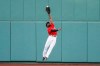 Boston Red Sox center fielder Jackie Bradley Jr. makes a leaping catch on a ball hit by Toronto Blue Jays' Rowdy Tellez during the sixth inning of the first game of a baseball doubleheader Friday, Sept. 4, 2020, at Fenway Park in Boston. (AP Photo/Winslow Townson)