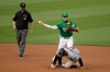 Oakland Athletics' Chad Pinder throws over Arizona Diamondbacks' Tim Locastro to complete a double play in the first inning of a baseball game Thursday, Aug. 20, 2020, in Oakland, Calif. Arizona's Ketel Marte was out at first base. (AP Photo/Ben Margot)