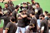 San Diego Padres' Fernando Tatis Jr. center, hugs Tommy Pham, after the Padres beat the Seattle Mariners in a baseball game Sunday, Sept. 20, 2020, in San Diego. The Padres clinched a spot in the playoffs. (AP Photo/Denis Poroy)