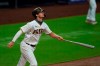 San Diego Padres' Wil Myers watches his grand slam during the first inning of the team's baseball game against the Colorado Rockies, Tuesday, Sept. 8, 2020, in San Diego. (AP Photo/Gregory Bull)