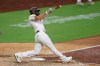 San Diego Padres' Eric Hosmer hits a three-RBI double during the seventh inning of a baseball game against the Arizona Diamondbacks, Friday, July 24, 2020, in San Diego. (AP Photo/Gregory Bull)