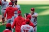 Los Angeles Angels center fielder Mike Trout, right, celebrates with teammates after the Angels defeated the San Diego Padres in a baseball game Wednesday, Sept. 23, 2020, in San Diego. (AP Photo/Gregory Bull)