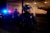 A protestor gestures towards a police official on Election Day, Tuesday, Nov. 3, 2020, in Los Angeles. (AP Photo/Jae C. Hong)