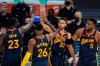 Golden State Warriors guard Stephen Curry (30) celebrates after scoring against the San Antonio Spurs with forward Draymond Green (23), forward Kent Bazemore (26) and forward Kevon Looney (5) during the first half of an NBA basketball game in San Francisco, Wednesday, Jan. 20, 2021. (AP Photo/Jeff Chiu)