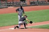 San Francisco Giants first baseman Brandon Belt, bottom, fields a ball in front of assistant coach Ron Wotus during a baseball practice in San Francisco, Sunday, July 5, 2020. (AP Photo/Jeff Chiu)