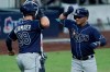 Tampa Bay Rays' Kevin Kiermaier, left, celebrates with Michael Perez after Perez hit a two-run home run to score Kiermaier against the New York Yankees during the sixth inning in Game 3 of a baseball American League Division Series, Wednesday, Oct. 7, 2020, in San Diego. (AP Photo/Jae C. Hong)
