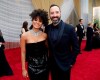 Zazie Beetz, left, and Tony Hale arrive at the Oscars on Sunday, Feb. 9, 2020, at the Dolby Theatre in Los Angeles. (AP Photo/John Locher)