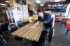 JOHN WOODS / WINNIPEG FREE PRESS
Allie Strom , a server at Bernstein’s Deli, cleans a table to during COVID-19 outbreak in Winnipeg Tuesday.