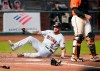 Arizona Diamondbacks' David Peralta (6) slide into home plate past San Francisco Giants catcher Joey Bart, right, to score a run during the fourth inning of a baseball game in San Francisco, Friday, Aug. 21, 2020. (AP Photo/Tony Avelar)