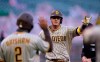 San Diego Padres' Manny Machado is congratulated by teammate Trent Grisham (2) after hitting a two-run home run against the San Francisco Giants during the third inning of a baseball game in San Francisco, Wednesday, July 29, 2020. (AP Photo/Tony Avelar)