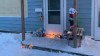 People placed candles, toys and flowers outside of a Portage la Prairie home where the bodies of a mother and two children were found dead a week ago. (CBC / Submitted by Kindra Stothers)