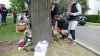 People left flowers and teddy bears at a vigil Sunday for a 12-year-old boy killed in an altercation on Burrows Avenue. (Walther Bernal / CBC)