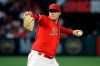 FILE - In this June 29, 2019, file photo, Los Angeles Angels starting pitcher Tyler Skaggs throws to the Oakland Athletics during a baseball game in Anaheim, Calif. Federal prosecutors say a former Angels employee has been charged with conspiracy to distribute fentanyl in connection with last year's overdose death of Angels pitcher Tyler Skaggs. Prosecutors in Texas say Eric Prescott Kay was arrested in Fort Worth, Texas, and made his first appearance Friday, Aug. 7, 2020, in federal court. Kay was communications director for the Angels. (AP Photo/Marcio Jose Sanchez, File)