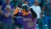 FILE In this Aug. 14, 2019, file photo, Colorado Rockies' Nolan Arenado celebrates as he circles the bases after hitting a walkoff, two-run home run off Arizona Diamondbacks relief pitcher Archie Bradley in the ninth inning of a baseball game in Denver. Arenado is at odds with the team's front office as the Rockies head to spring training for the season ahead. (AP Photo/David Zalubowski, File)