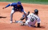 Texas Rangers shortstop Elvis Andrus, left, tags out Colorado Rockies' Charlie Blackmon at second base as Blackmon was trying to stretch an RBI-single into a double in the second inning of a baseball game Sunday, Aug. 16, 2020, in Denver. (AP Photo/David Zalubowski)