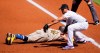 Colorado Rockies first baseman Josh Fuentes, front, fields the pickoff throw from starting pitcher Ryan Castellani as San Diego Padres' Jake Cronenworth dives back to first base in the first inning of a baseball game Sunday, Aug. 30, 2020, in Denver.(AP Photo/David Zalubowski)
