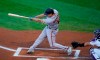 San Francisco Giants' Alex Dickerson connects for a solo home run off Colorado Rockies starting pitcher Jon Gray as catcher Tony Wolters looks for the pitch in the first inning of a baseball game Tuesday, Sept. 1, 2020, in Denver. (AP Photo/David Zalubowski)