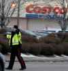 SHANNON VANRAES / WINNIPEG FREE PRESS FILES
Members of the Winnipeg Police Service direct traffic in front of the St. James's Costco store in November. The Winnipeg Police Service says 481 off-duty officers have been hired so far this month to serve as armed paid security during the busiest shopping period of the year.