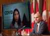 Health Minister Jean-Yves Duclos and Chief Public Health Officer Theresa Tam listen to a question during a news conference, Friday, November 26, 2021 in Ottawa.  THE CANADIAN PRESS/Adrian Wyld