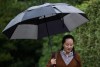 Huawei chief financial officer Meng Wanzhou, who is out on bail and remains under partial house arrest after she was detained last year at the behest of American authorities, carries an umbrella to shield herself from rain as she leaves her home to attend a court hearing, in Vancouver on Thursday October 3, 2019. Wanzhou says she has experienced feelings of helplessness, torment and struggle since being arrested one year ago, but no long fears the unknown. THE CANADIAN PRESS/Darryl Dyck