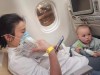 Summer Wu and her one-year-old son Felix wait on a plane destined for Canada to leave the Wuhan Tianhe International Airport early in the morning on Friday, Feb. 7, 2020 in this handout photo provided by Wu's husband Michael Schellenberg. Michael is in Wuhan in Hubei province with his wife Summer Wu and their one-year-old son Felix. THE CANADIAN PRESS/HO, Michael Schellenberg *MANDATORY CREDIT*