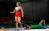 Canada's Erica Wiebe, left, celebrates after defeating Nigeria's Blessing Onyebuchi, right on the ground, to win Gold medal in women's FS 76Kg wrestling at the Commonwealth Games on Gold Coast, Australia, Thursday, April 12, 2018. An Olympic wrestling qualifier in Ottawa is still going ahead but is now closed to spectators. THE CANADIAN PRESS/AP/Manish Swarup