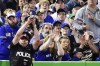 The Toronto Blue Jays announced Thursday that the protective netting at Rogers Centre will be extended down the length of the first and third baseline walls. A police officer tries to catch a foul ball during seventh inning of a baseball game between the Toronto Blue Jays and Seattle Mariners, in Toronto, May 14, 2017. THE CANADIAN PRESS/Frank Gunn