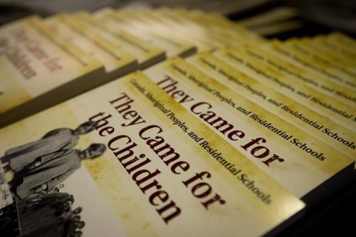 Historical books detailing residential schools released by the Truth and Reconciliation Commission sit on a table as the commission releases an interim report during a news conference in Vancouver, B.C., on Friday February 24, 2012. THE CANADIAN PRESS/Darryl Dyck