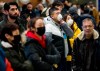 People wear masks as they wait for the arrivals at the International terminal at Toronto Pearson International Airport in Toronto on Saturday, January 25, 2020. Leaders of Toronto's Chinese community said Wednesday the racist attitudes that led to widespread discrimination against Chinese Canadians during the SARS epidemic are threatening to resurface during the current outbreak of a new coronavirus.THE CANADIAN PRESS/Nathan Denette