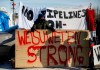 Supporters of the Wet'suwet'en hereditary chiefs block a CN Rail line just west of Edmonton Alta, on Wednesday February 19, 2020. THE CANADIAN PRESS/Jason Franson