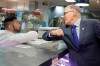 Washington Gov. Jay Inslee, right, bumps elbows with a worker at the seafood counter of the Uwajimaya Asian Food and Gift Market, Tuesday, March 3, 2020, in Seattle's International District. Inslee said he's doing the elbow bump with people instead of shaking hands to prevent the spread of germs, and that his visit to the store was to encourage people to keep patronizing businesses during the COVID-19 Coronavirus outbreak. THE CANADIAN PRESS/AP-Ted S. Warren