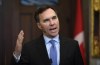 Minister of Finance Bill Morneau makes an announcement on lowering taxes for the middle class in the Foyer of the House of Commons on Parliament Hill in Ottawa on December 9, 2019. Federal Finance Minister Bill Morneau will provide his first update for Canadians today on the state of the economy -- and the government's books -- since the October election. The update comes as Morneau prepares to host provincial finance ministers for two days of talks this week, in which the amount of federal assistance provided to provinces dealing with economic downturns is expected to figure prominently. THE CANADIAN PRESS/Justin Tang