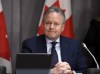 Governor of the Bank of Canada Stephen Poloz listens to a question at a press conference on Parliament Hill in Ottawa, on Wednesday, March 18, 2020. Canada's central bank will make an announcement today on its key interest rate and detail the impact of COVID-19 on the national economy. THE CANADIAN PRESS/Justin Tang