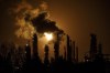 A flare stack lights the sky from the Imperial Oil refinery in Edmonton on December 28, 2018. A new climate change think tank funded by the federal government says Canadians should expect to face the harsh realities of a changing climate even under the most aggressive global efforts to curb fossil fuel use and cut greenhouse gas emissions. THE CANADIAN PRESS/Jason Franson