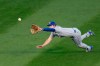 Kansas City Royals' Brett Phillips dives for, but is unable to catch a fly ball from Chicago Cubs' Kris Bryant during the first inning of a baseball game Monday, Aug. 3, 2020, in Chicago. (AP Photo/Charles Rex Arbogast)