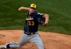 Milwaukee Brewers starting pitcher Brandon Woodruff (53) throws the ball against the Chicago Cubs during the first inning of an opening day baseball game Friday, July, 24, 2020, in Chicago. (AP Photo/David Banks)