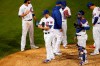 Chicago Cubs relief pitcher Craig Kimbrel, second from left, is taken out of the baseball game by manager David Ross during the ninth inning against the Kansas City Royals on Tuesday, Aug. 4, 2020, in Chicago. The Cubs won 5-4. (AP Photo/Charles Rex Arbogast)