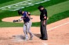 Minnesota Twins' Josh Donaldson kicks dirt on home plate after his home run prompting umpire Dan Bellino to eject him from the game during the sixth inning of a baseball game against the Chicago White Sox Thursday, Sept. 17, 2020, in Chicago. (AP Photo/Charles Rex Arbogast)