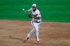Chicago White Sox third baseman Yoan Moncada can't make the play on a single by Cleveland Indians' Carlos Santana during the 10th inning of a baseball game in Chicago, Sunday, Aug. 9, 2020. (AP Photo/Nam Y. Huh)