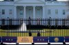 A security team patrols in front of the White House as preparations continue ahead of President-elect Joe Biden's inauguration ceremony, Tuesday, Jan. 19, 2021, in Washington. (AP Photo/David Phillip)