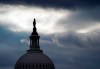 The bronze Statue of Freedom, by Thomas Crawford, is the crowning feature of the dome of the U.S. Capitol, shown ahead of the inauguration of President-elect Joe Biden and Vice President-elect Kamala Harris, Sunday, Jan. 17, 2021, in Washington. (AP Photo/Julio Cortez)